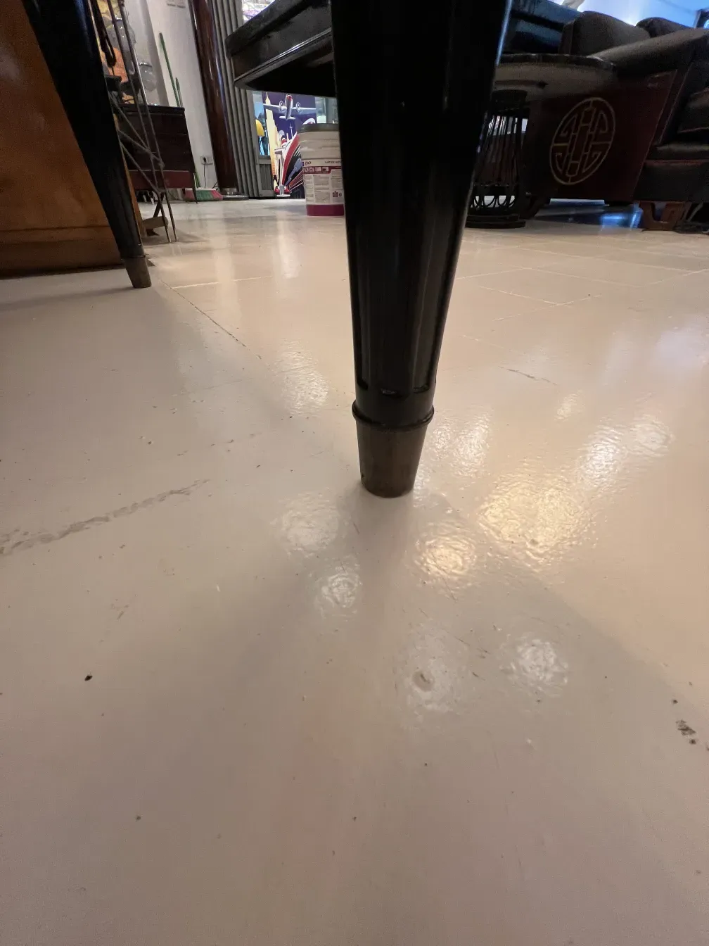 View of an antique desk leg from Nordiska Kompaniet, set in a vintage environment.