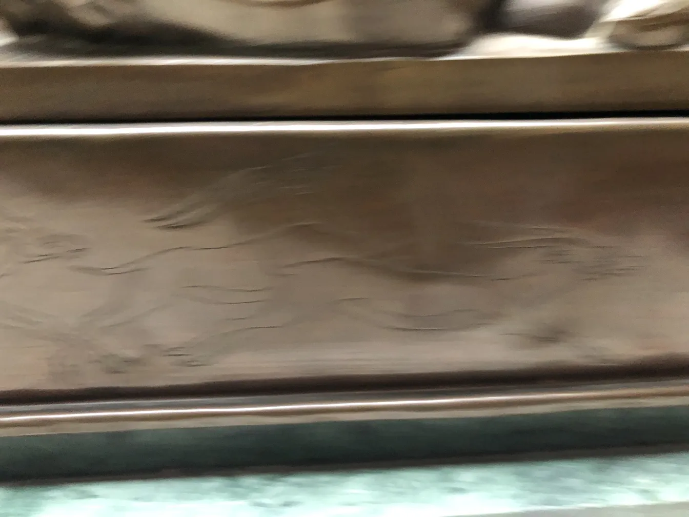 antique sculpture with detailed engravings and textures