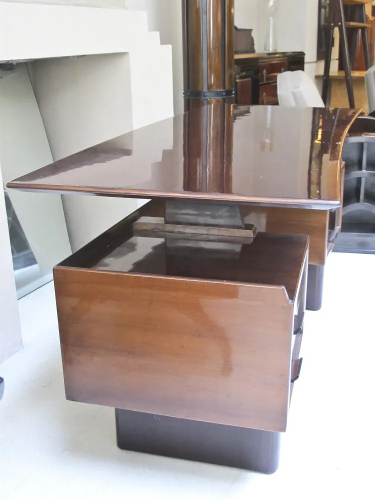 antique desk with shiny surface and drawers