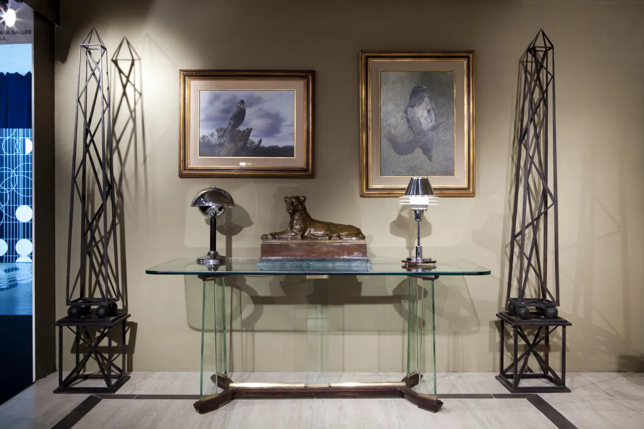 antique sculpture of a dog on glass table