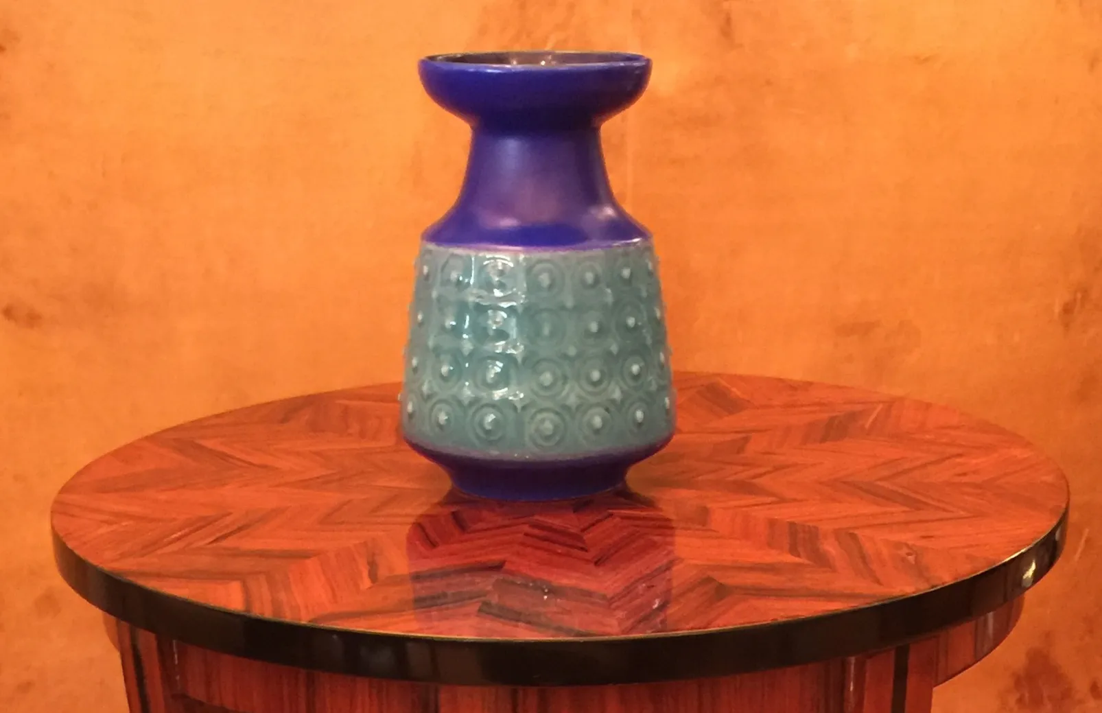 antique ceramic vase with blue and green details