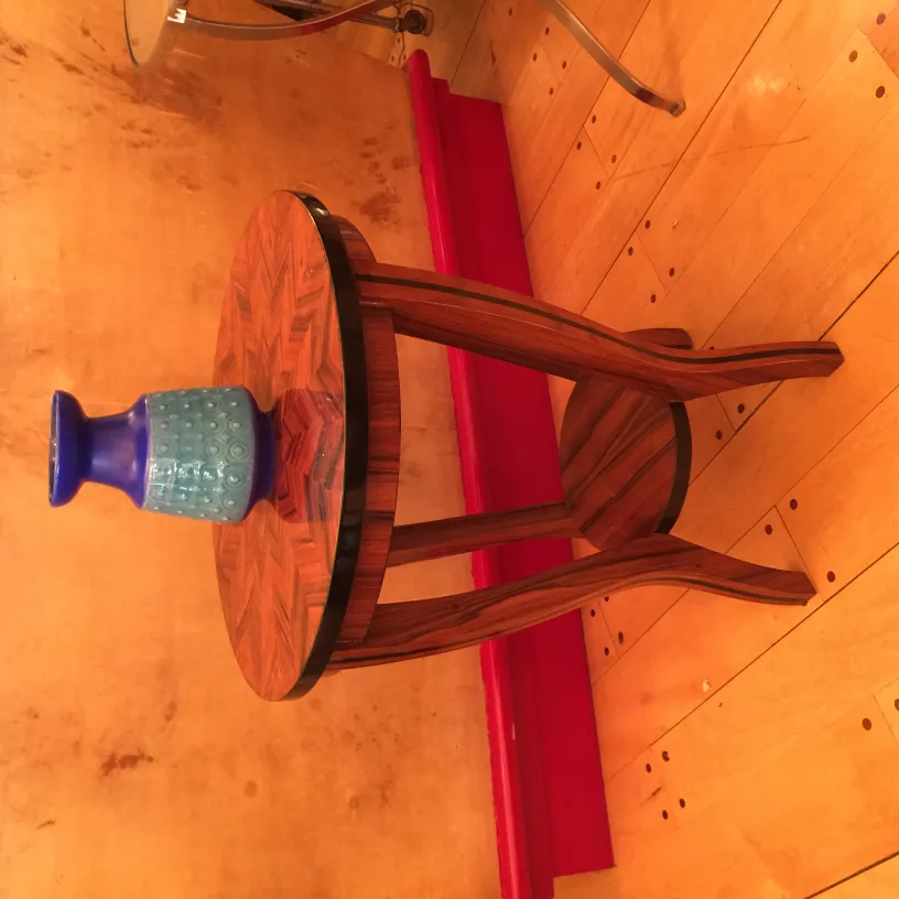 Antique ceramic vase on decorative wooden table