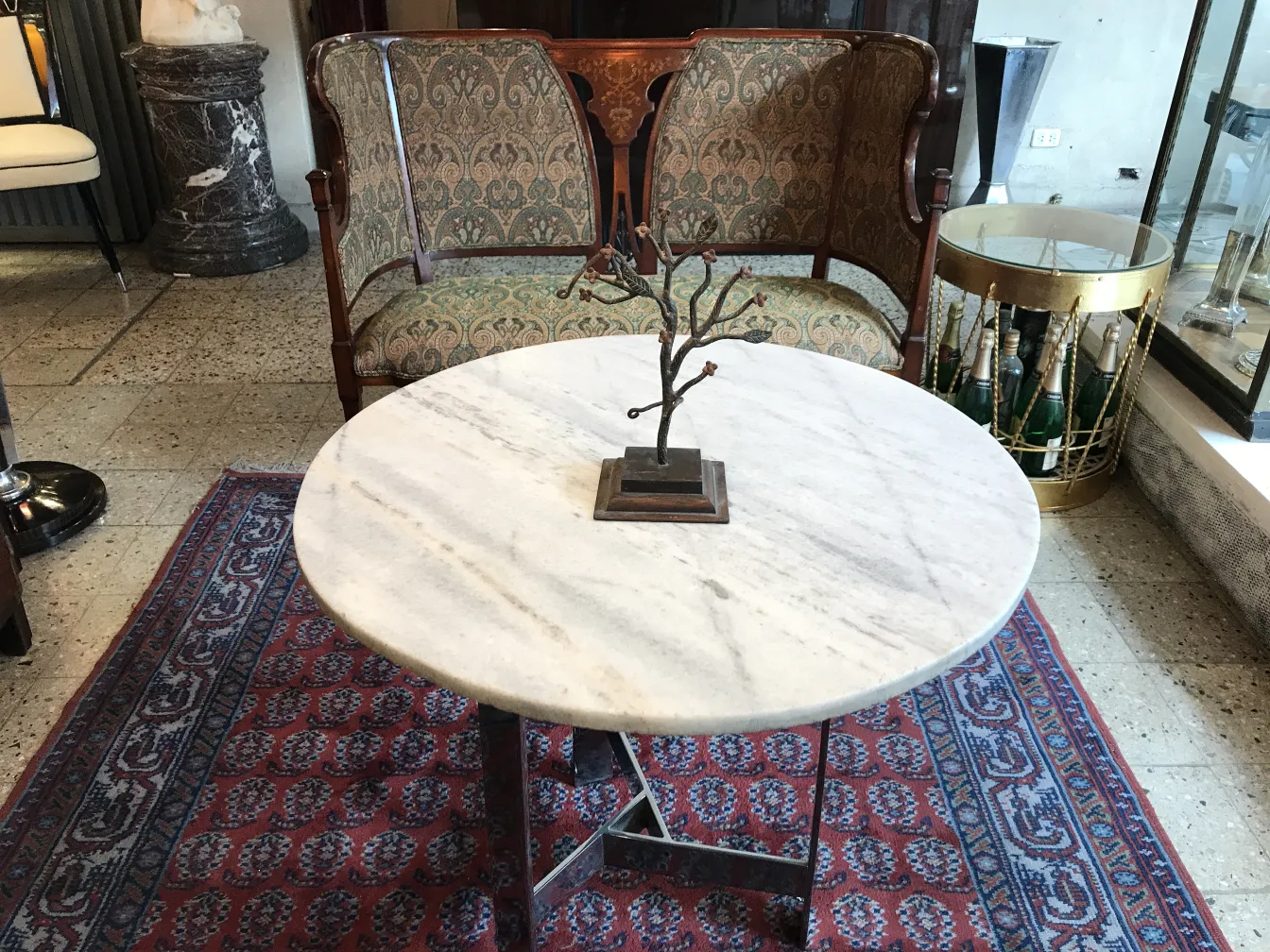 ancient sculpture showcased on elegant table in room