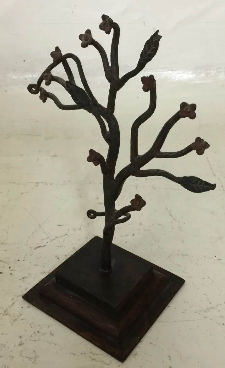 antique sculpture with branches and decorative flowers