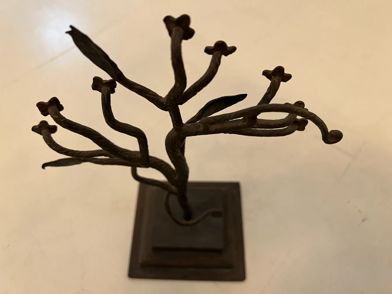 Ancient sculpture depicting branches with unique details