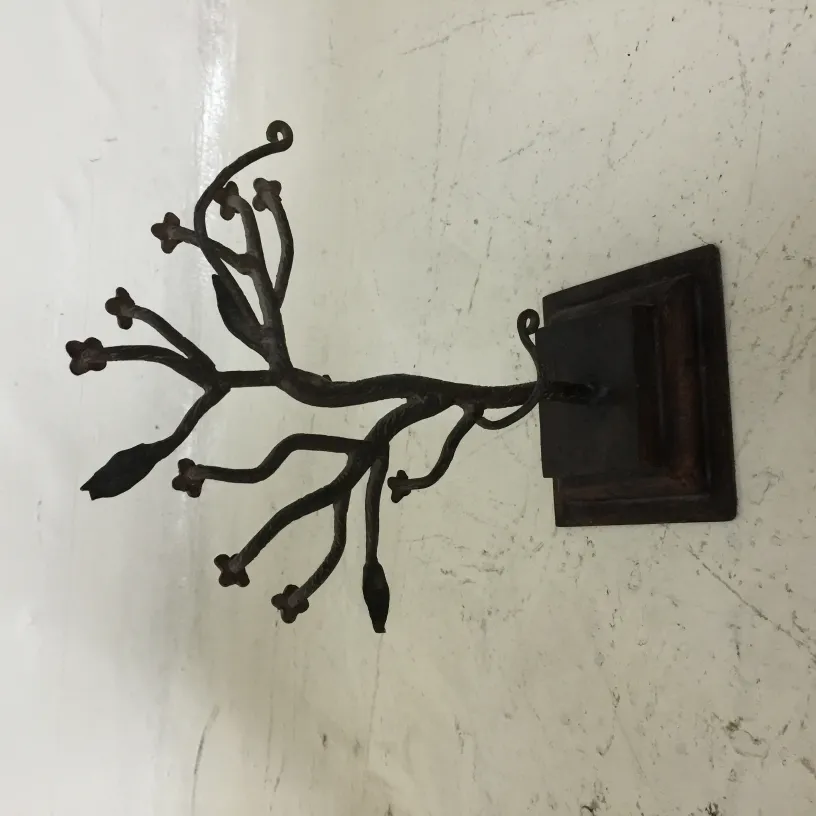 antique sculpture depicting branches with flowers
