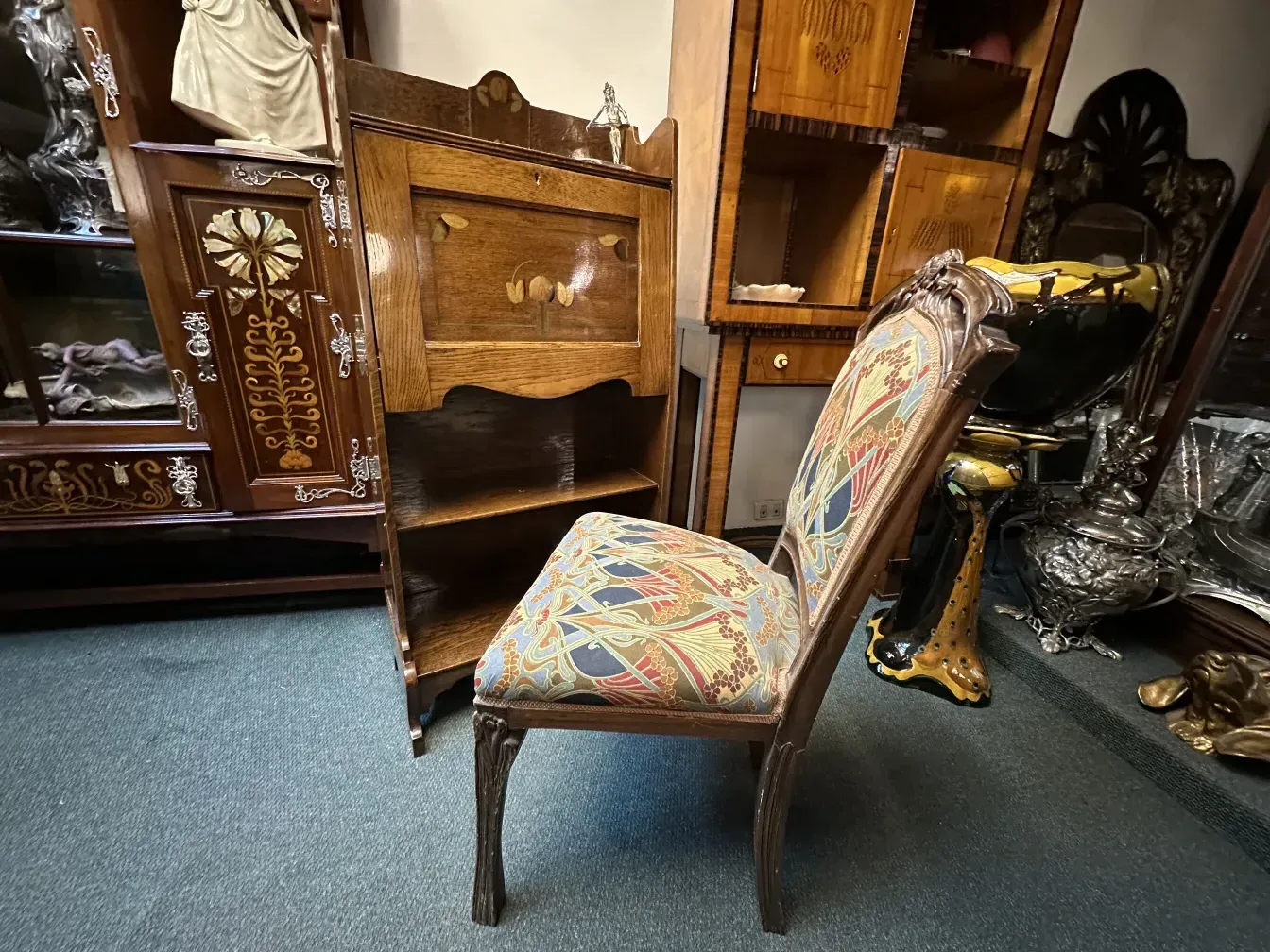 antique desk with decorative base and covering