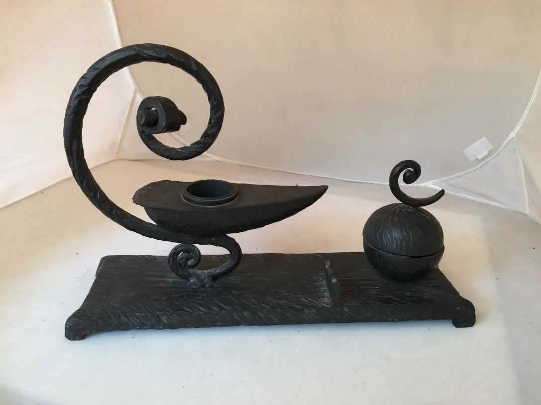 antique sculpture with curved shapes and flat base