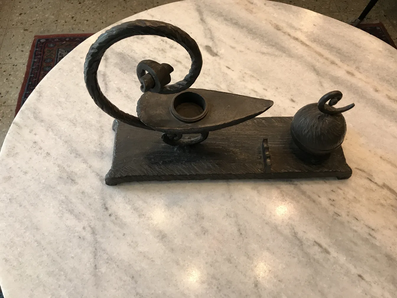 Antique sculpture with elegant decorative design in metal