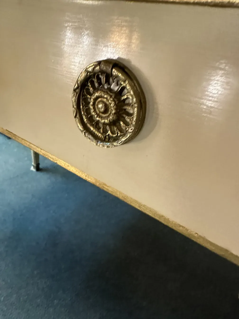 detail of an antique desk at Alvear Palace, featuring a decorative handle