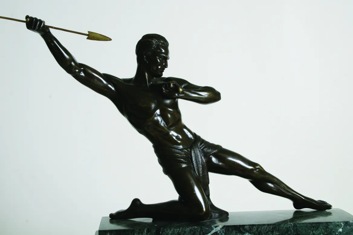 ancient sculpture representing a man throwing a spear