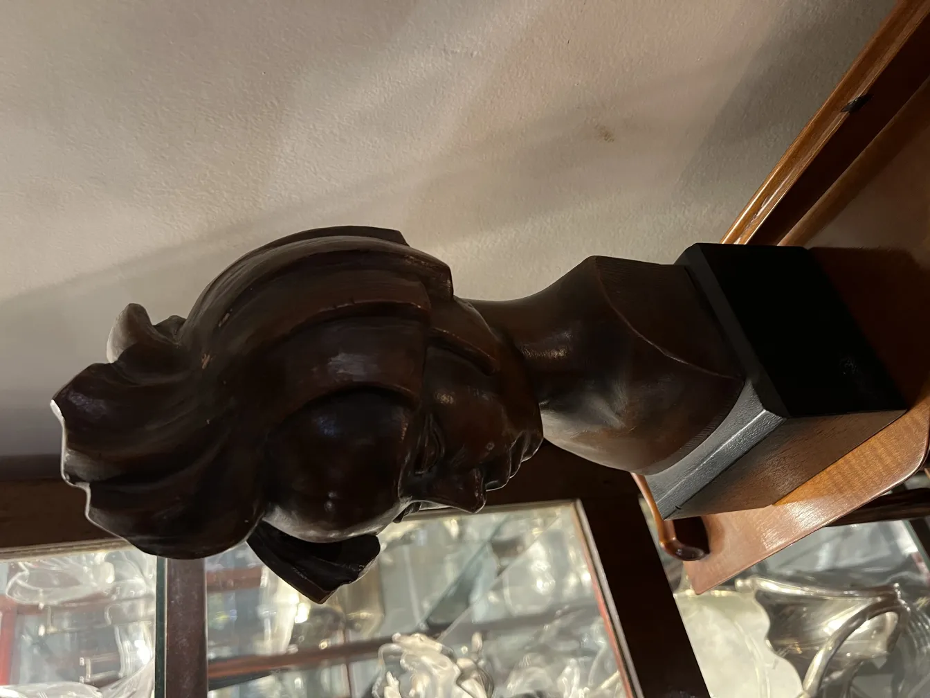 antique bust sculpture with detailed hair design