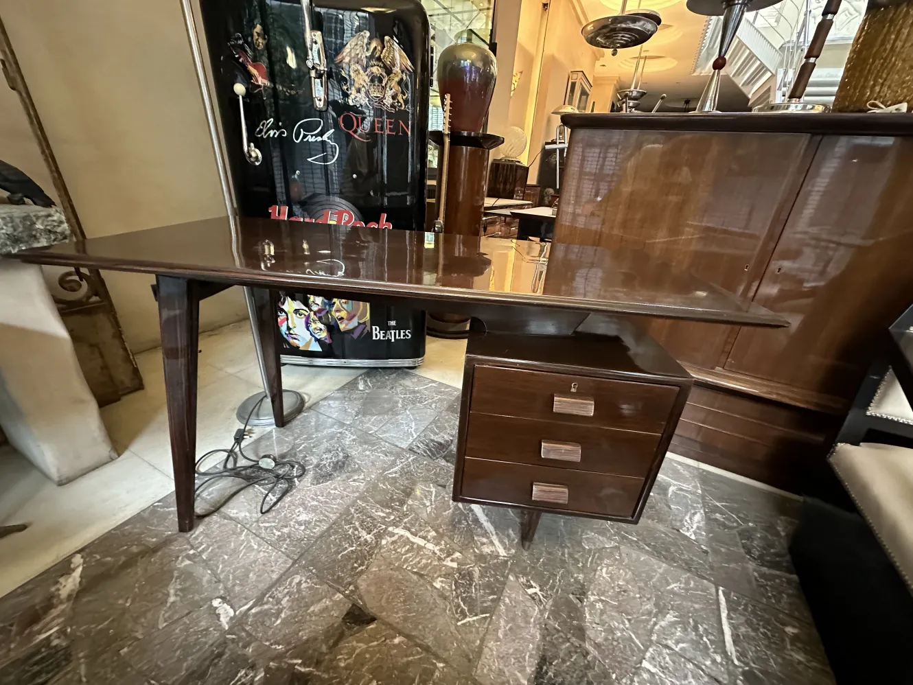 Elegant antique desk featuring two drawers and a stylish design