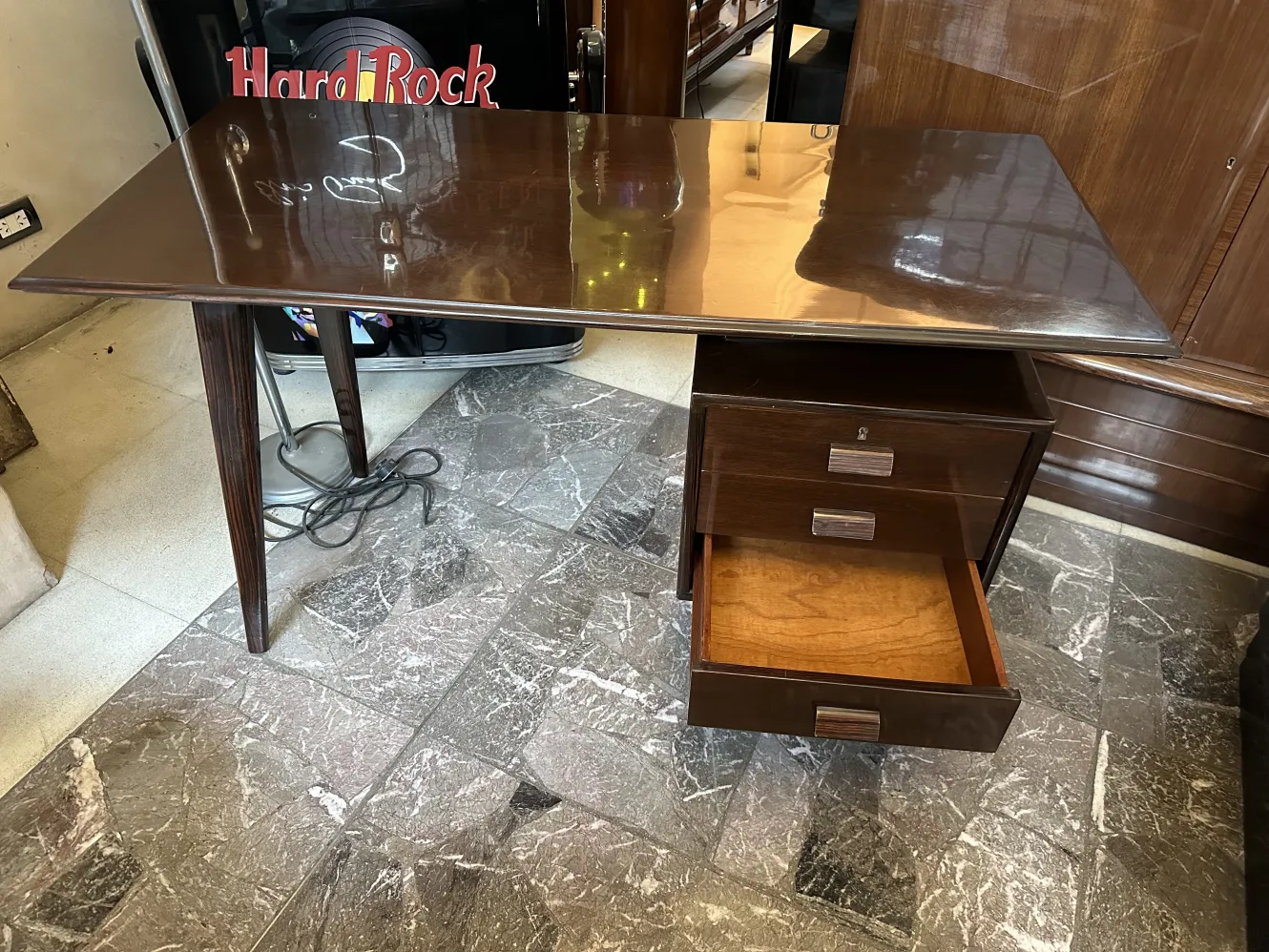 Antique desk featuring two drawers and a glossy surface.