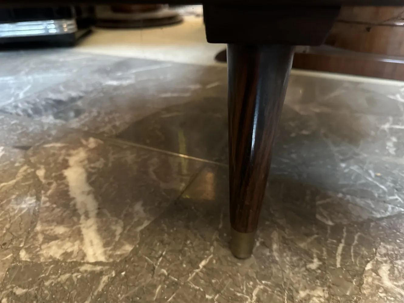 Antique desk with elegant legs in a classic setting