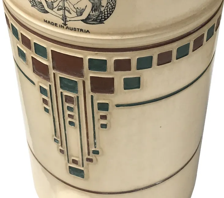 antique ceramic with geometric decoration in beige and brown tones