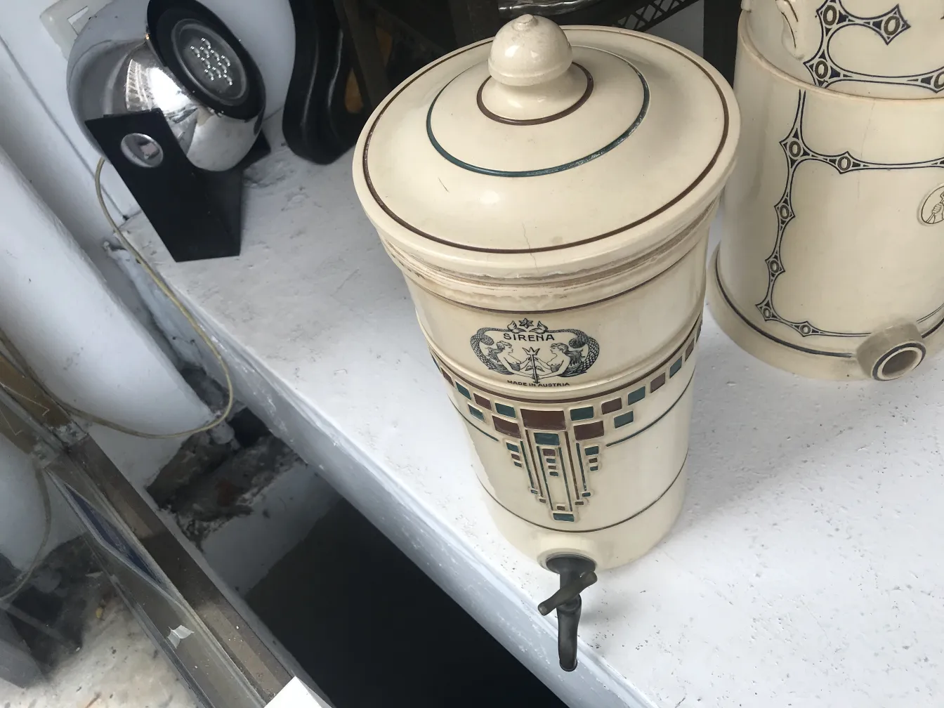 Antique ceramic jar featuring elegant decoration and a distinctive design.