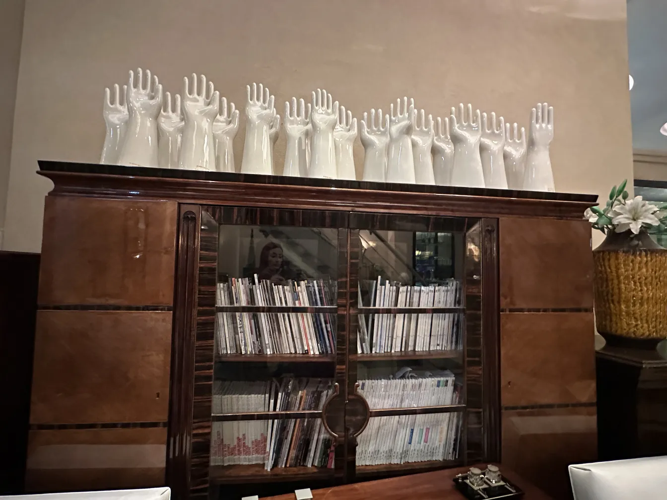 Antique ceramic decoration featuring hands on display.