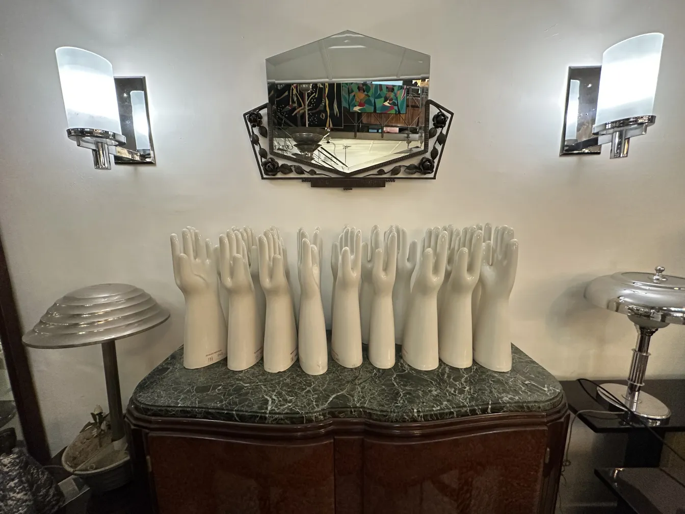 Antique ceramic hands on an elegant display case