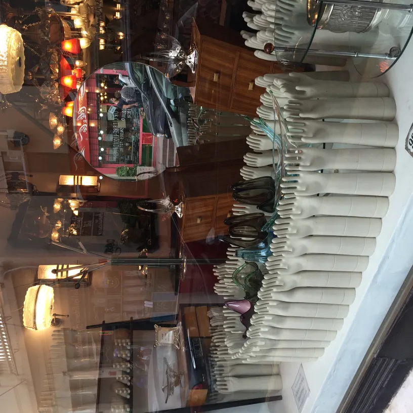 showcase with white antique ceramics and decorative items