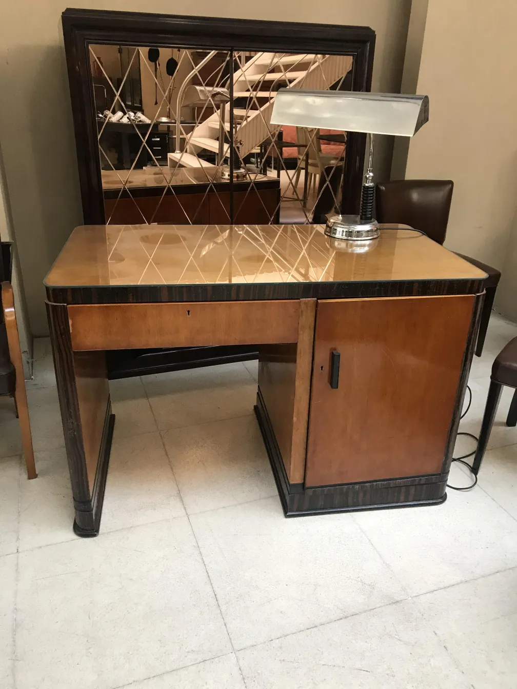 antique desk with lamp and storage space