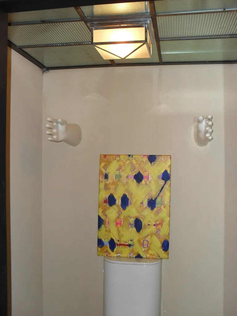 Decorative antique ceramic piece with colorful details in a modern setting.