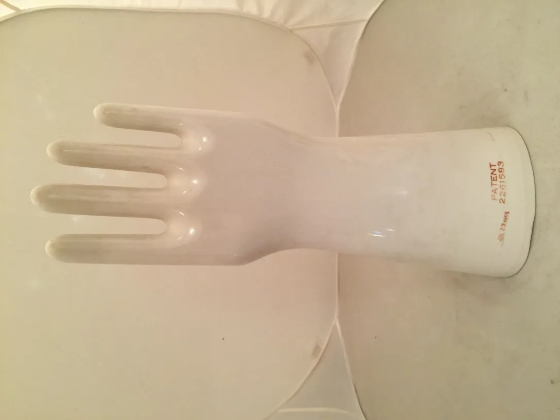 Decorative antique ceramic hand displayed upright