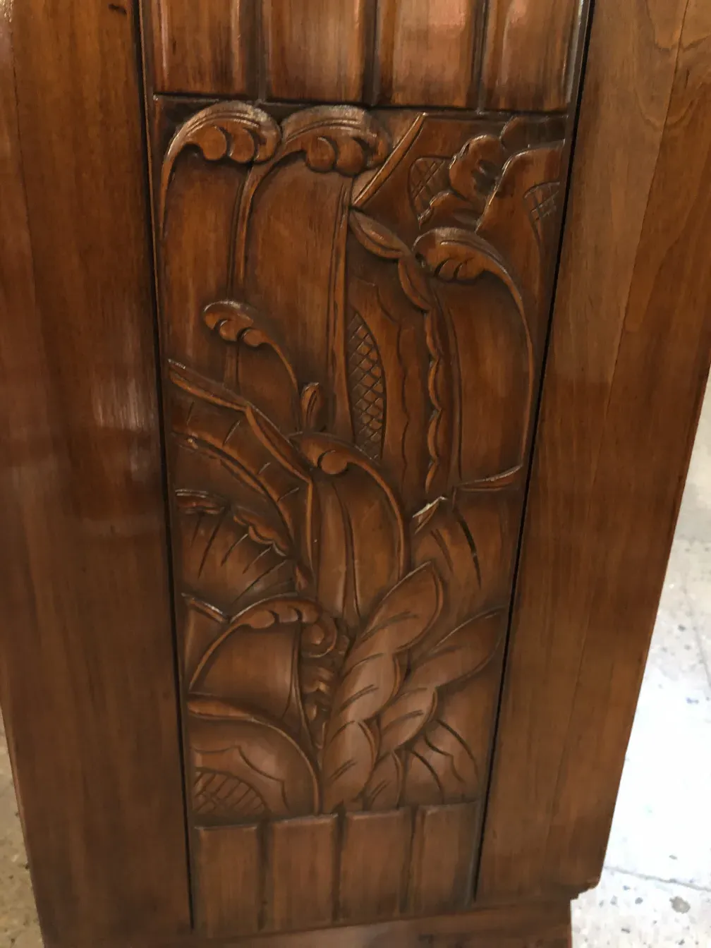 Antique wooden desk with intricate carved details