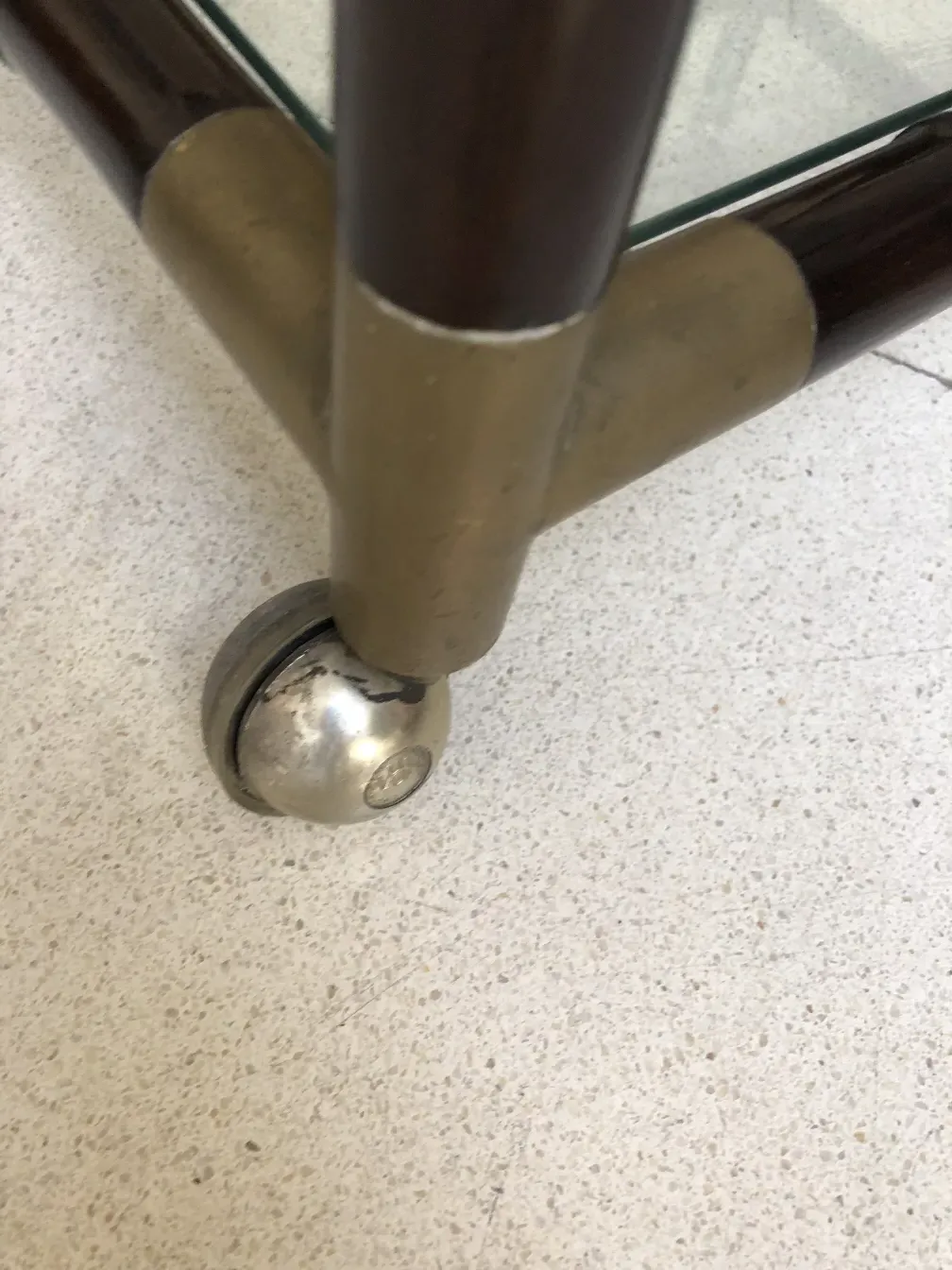 close-up of wheels on a vintage cocktail trolley by Billy Haines