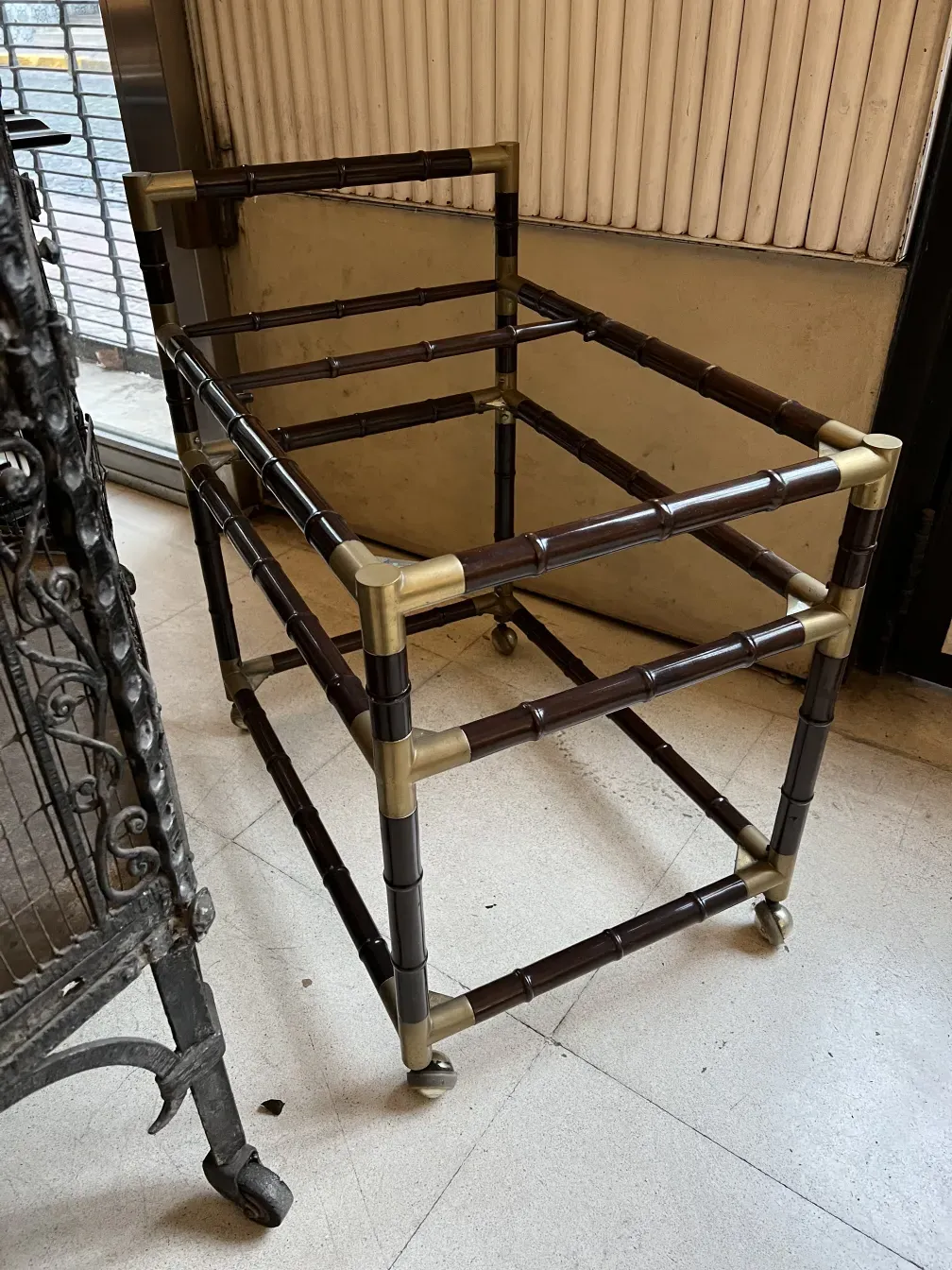 antique cocktail trolley with wheels and metal frame