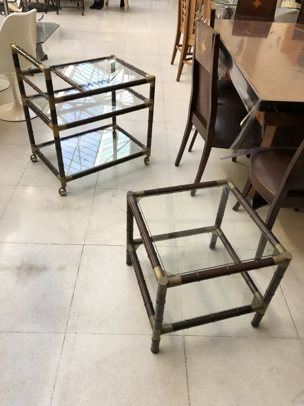 Antique cocktail trolley with multiple levels and wheels.