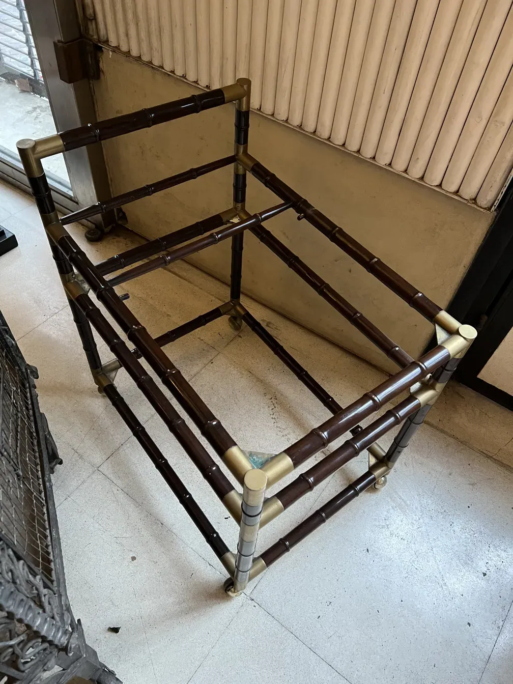 antique cocktail trolley billy haines with bamboo-like structure, in a neutral setting