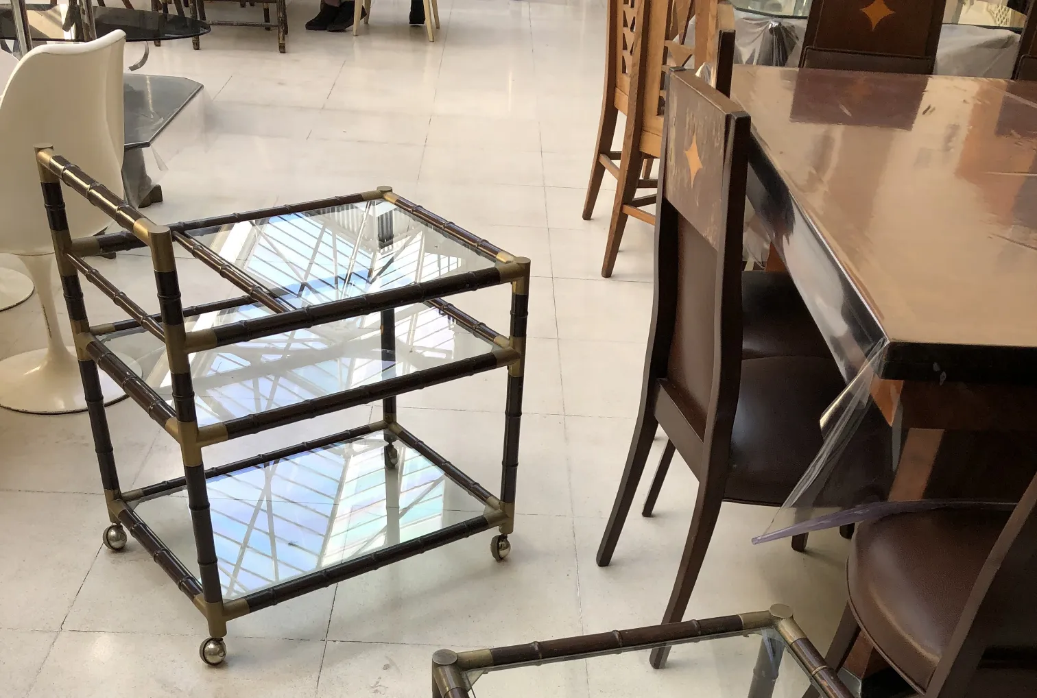 antique cocktail trolley billy haines with wheels and glass shelves.