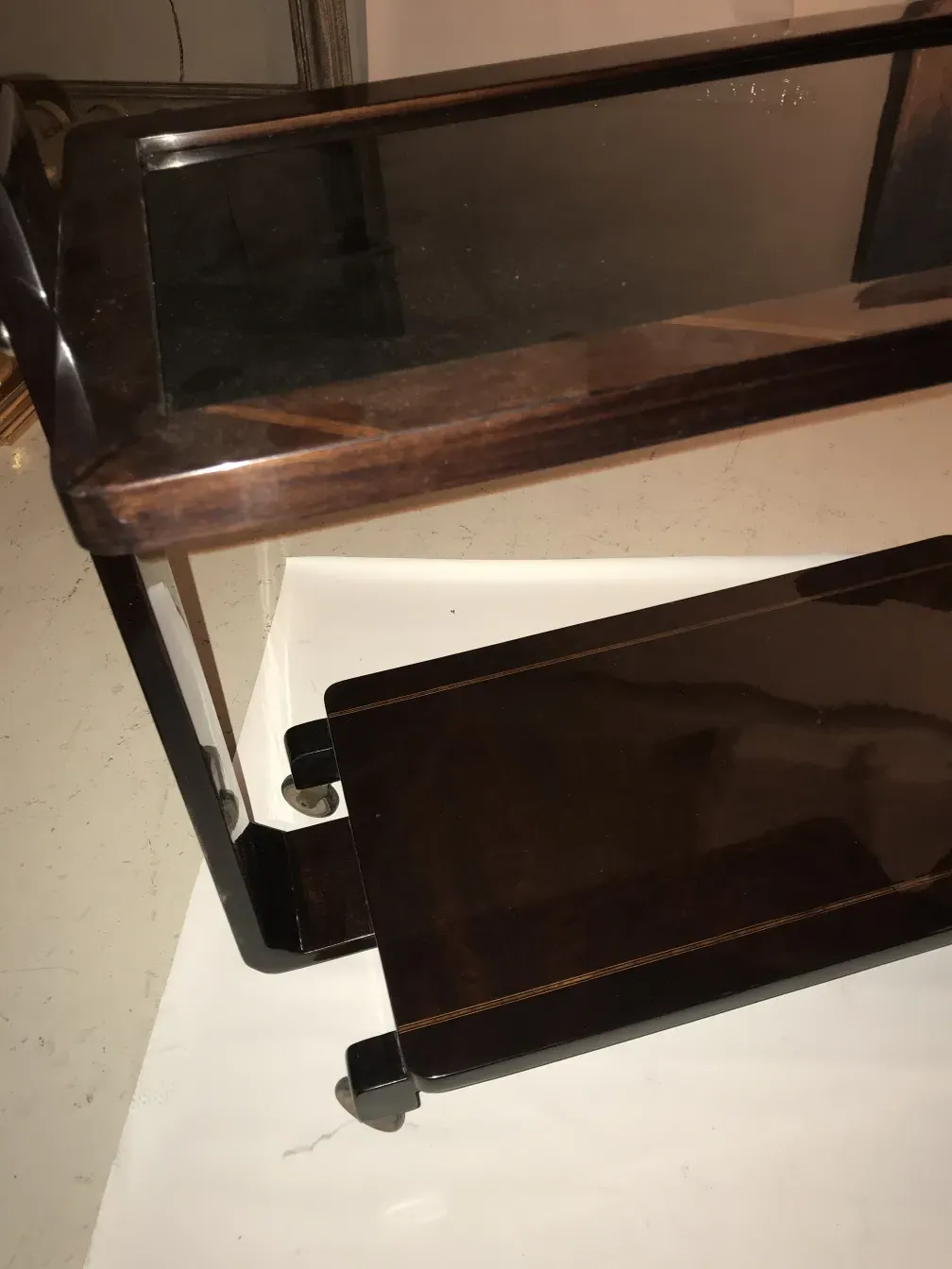 Antique cocktail trolley with a sleek and smooth finish.