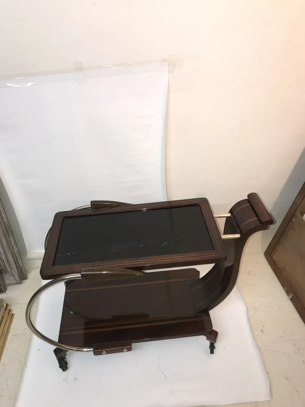 Antique cocktail trolley with elegant design and metal details.