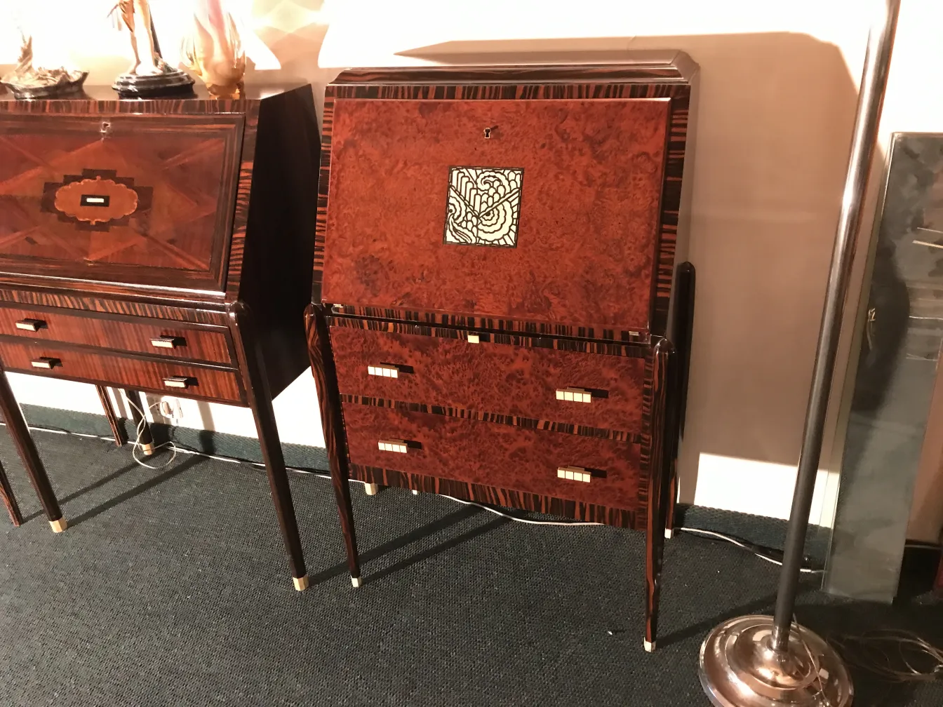 Antique desk with ornate design and elegant legs, two drawers