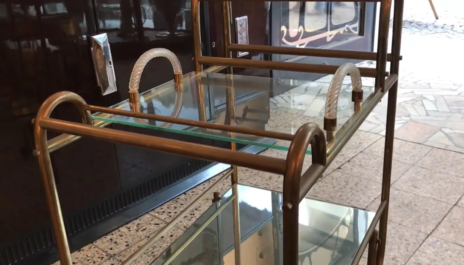 Antique cocktail trolley with metal frame and glass