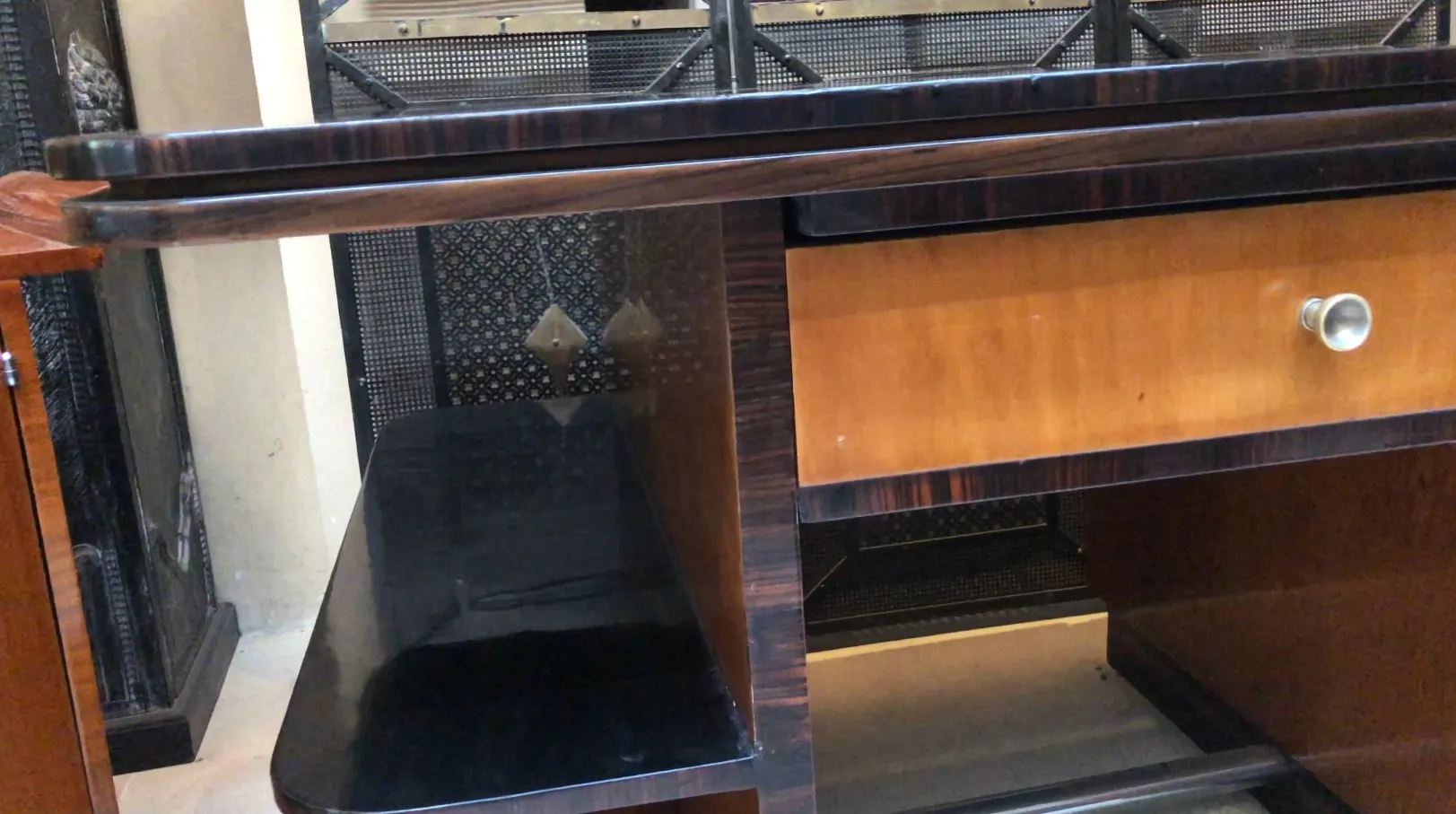 Antique desk featuring shelves and drawers made of dark wood.