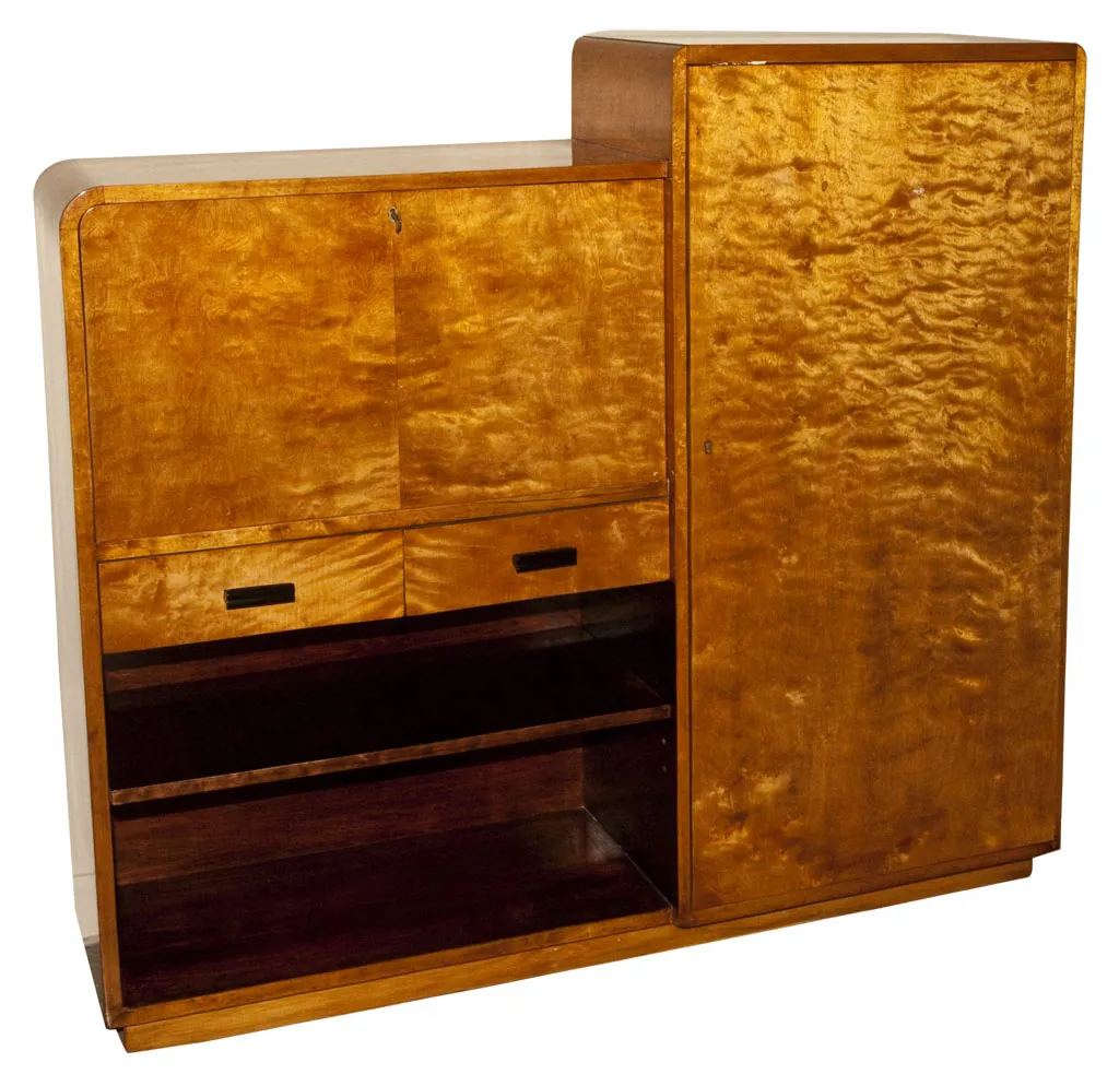 Antique desk with light finish and storage compartments.