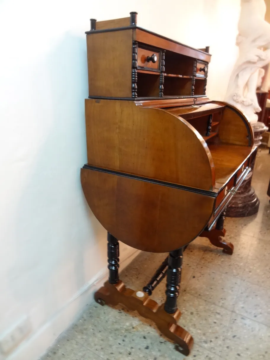 Antique desk featuring elegant finishes, shelves, and two drawers. Perfect for sophisticated settings.