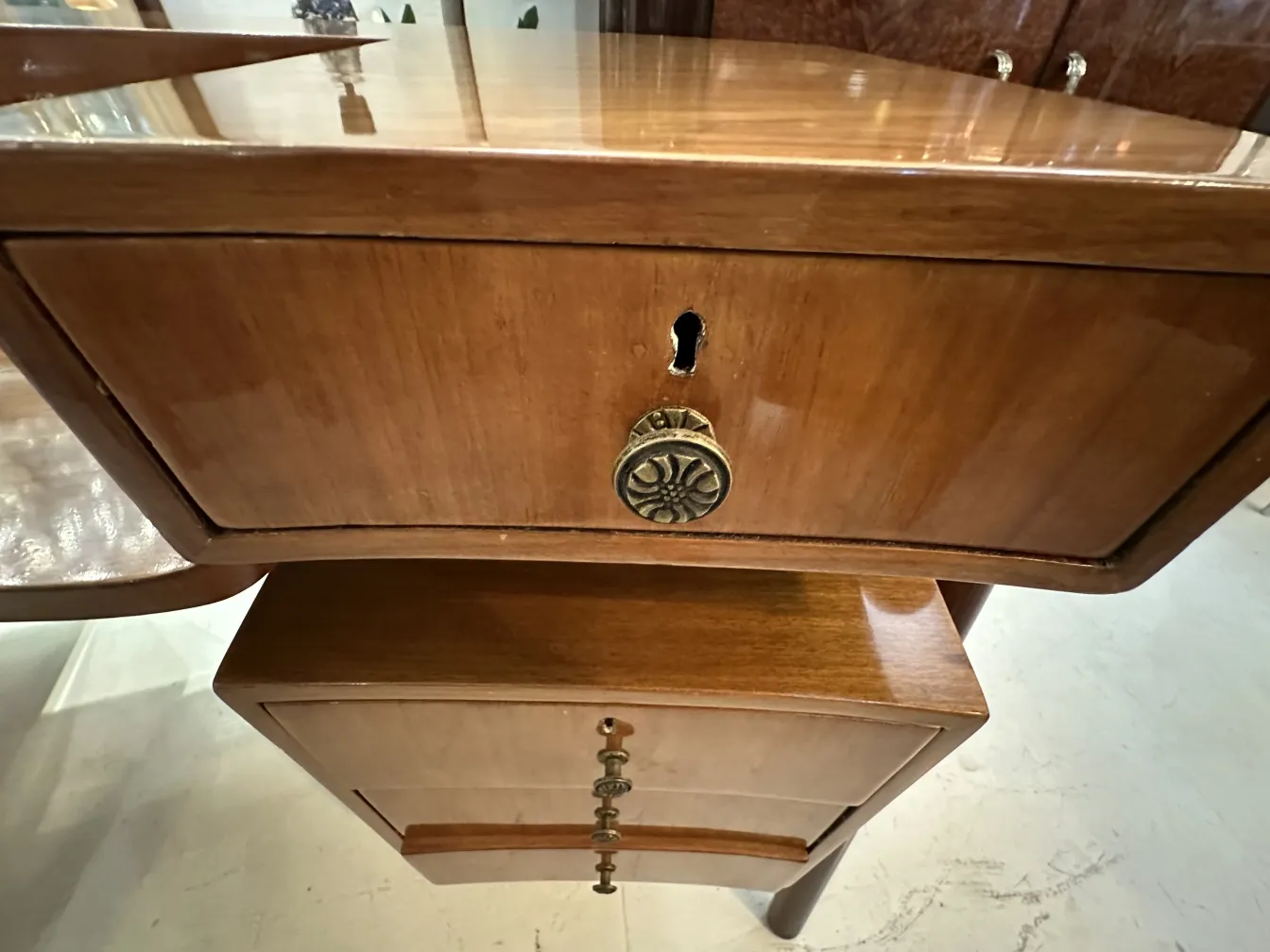 Antique desk featuring two dark wood drawers, elegant and classic.