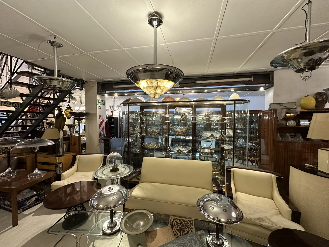 Antique hanging lamp with classic design in a living room setup.