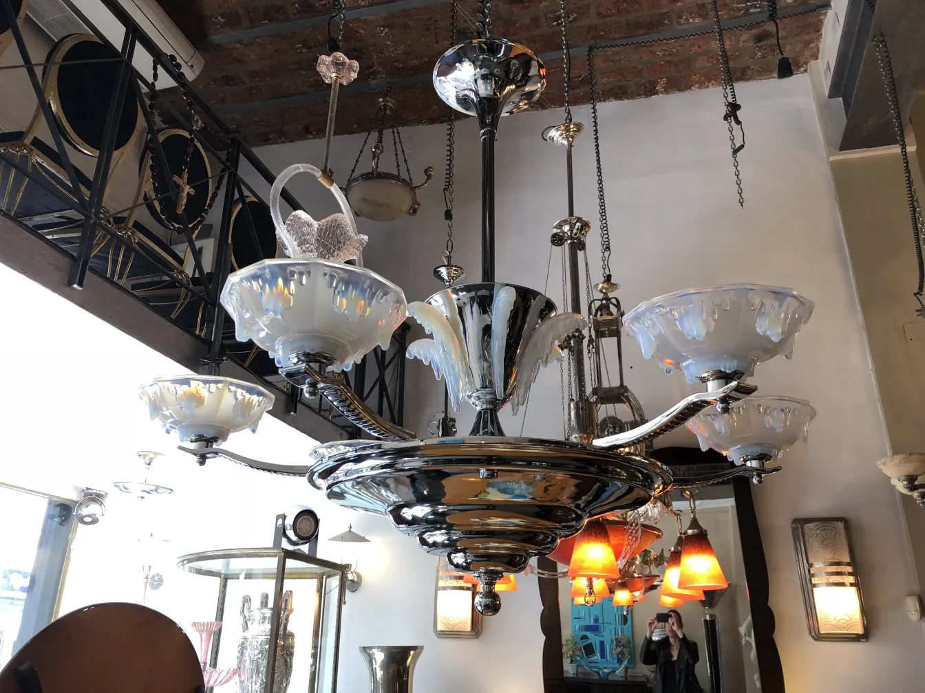 Antique hanging lamp with shiny finish and decorative details.