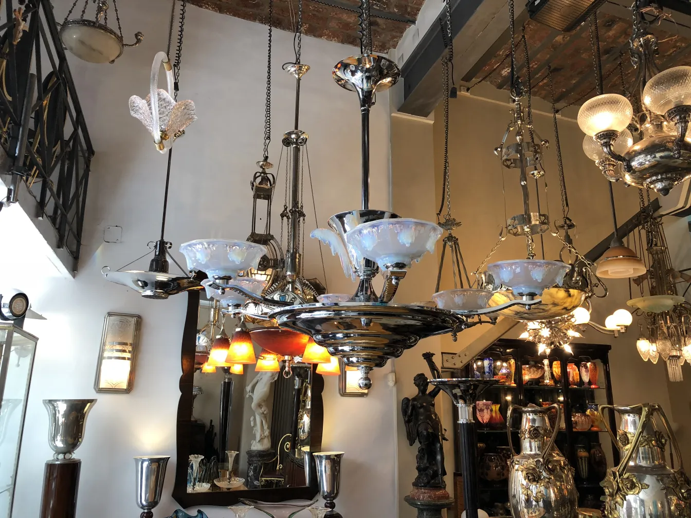 Antique hanging lamp with a classic design, set in an elegant decor environment.