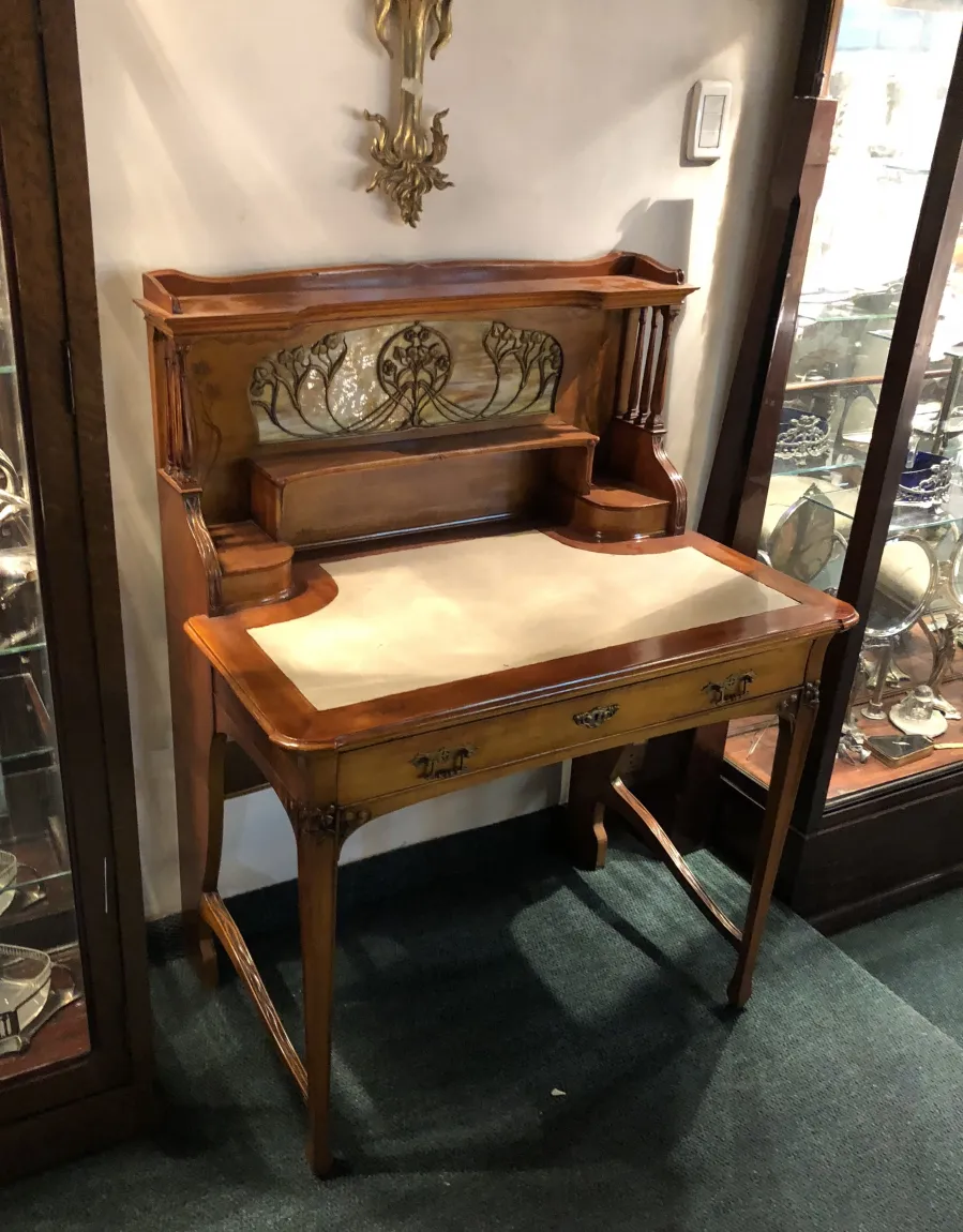 antique desk by louis majorelle with vibrant background and decorative details