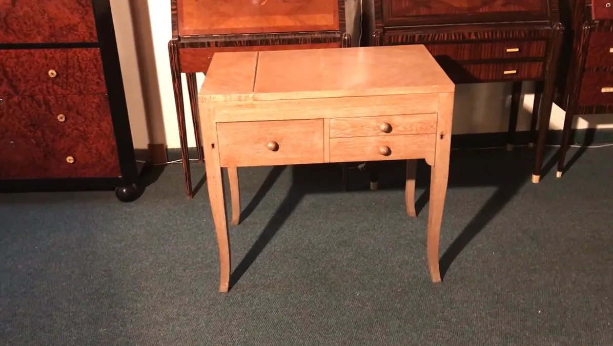 wooden antique desk with two drawers, dark background