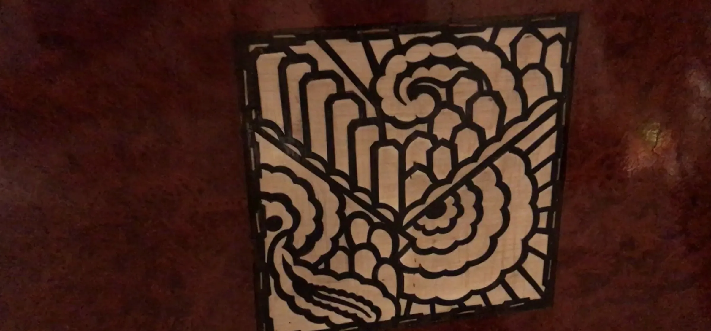 Antique desk featuring a decorative design on the surface