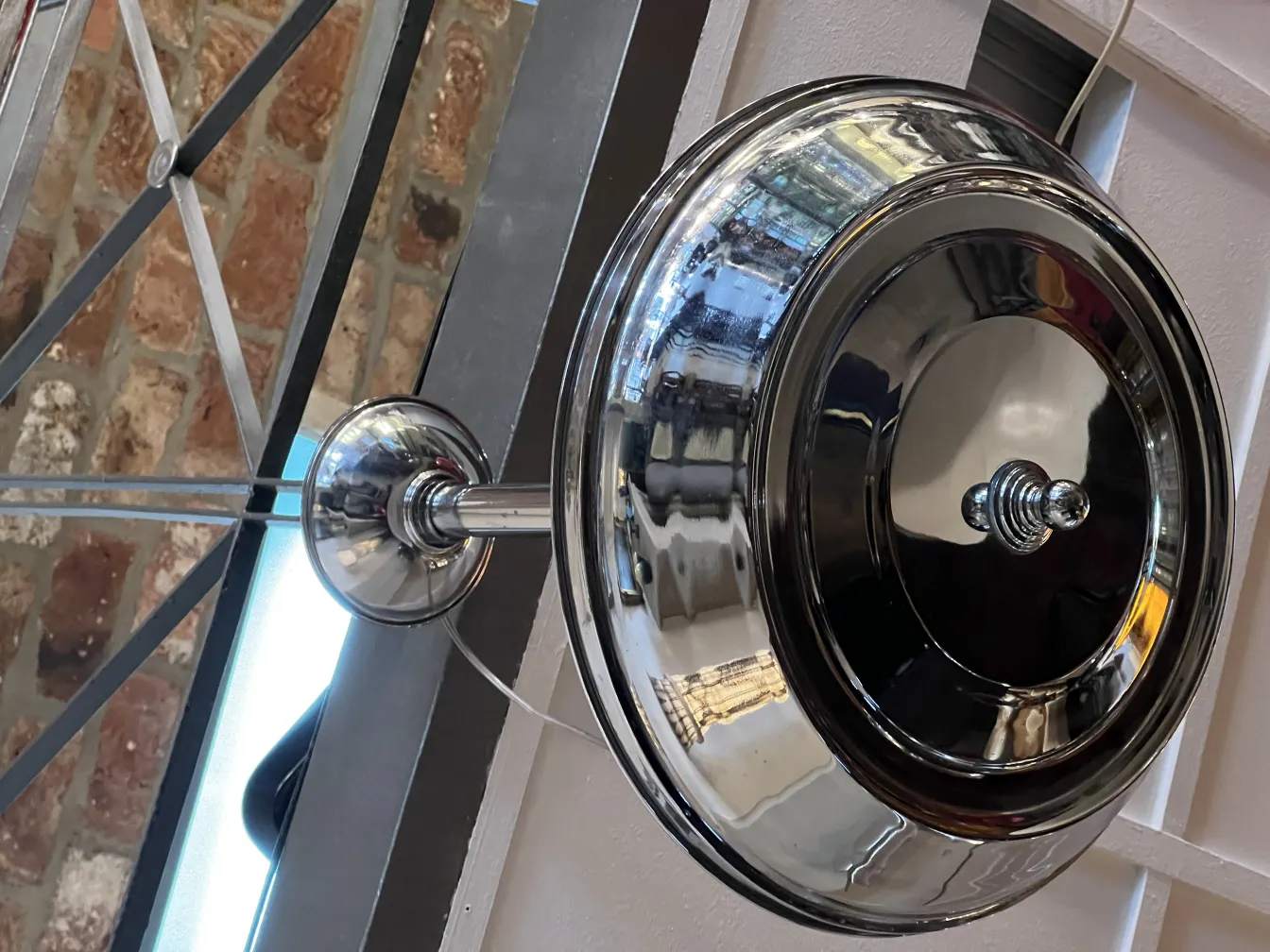 Antique hanging lamp with a shiny finish, elegant ambiance.