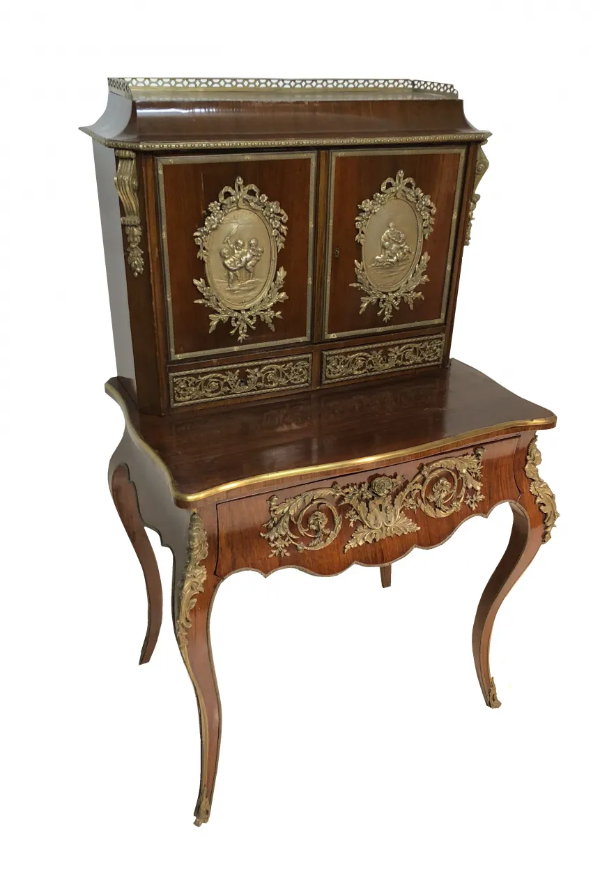 Antique desk with intricate decoration and embossed details.
