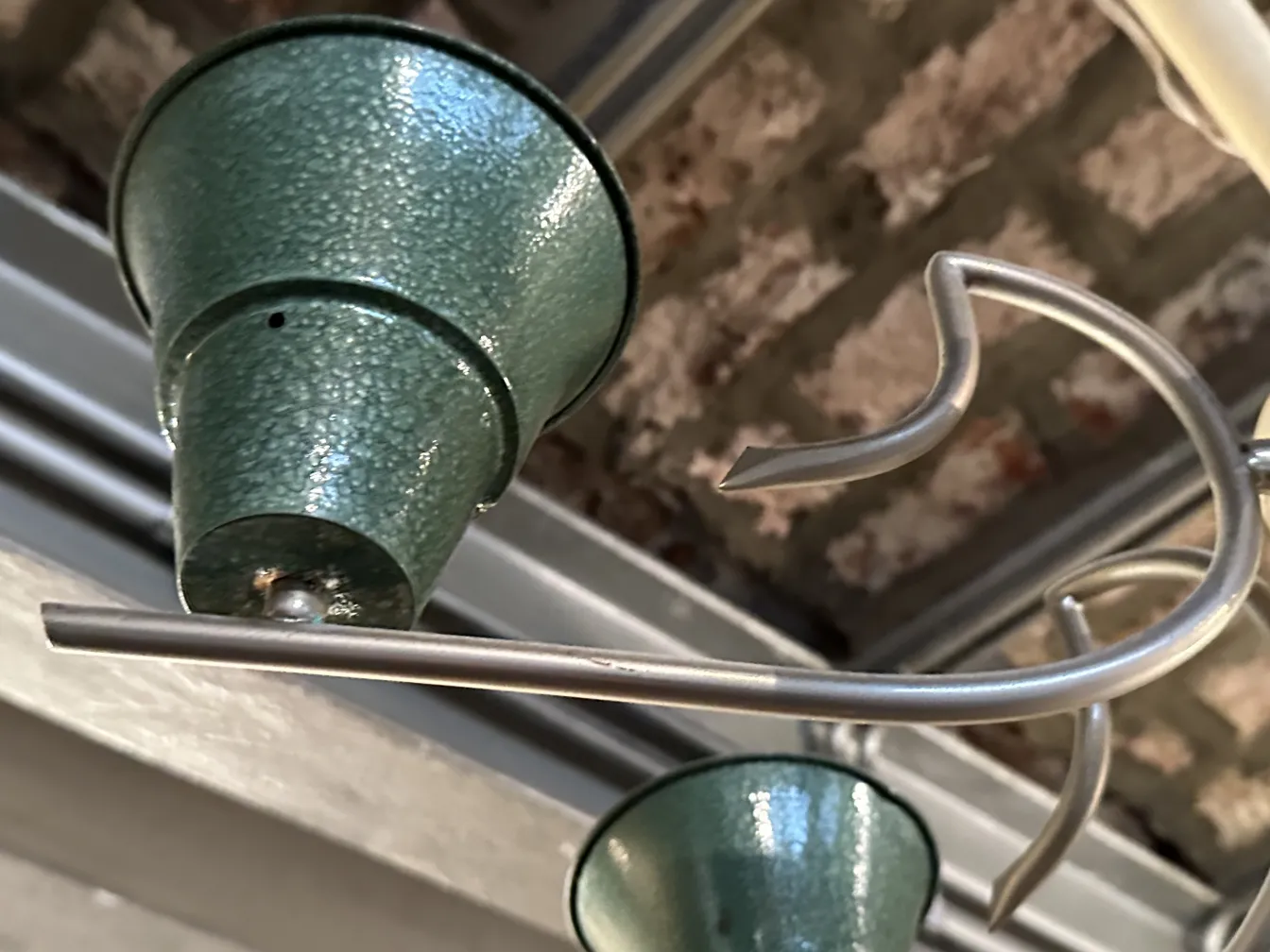 Antique hanging lamp in green color with unique design.